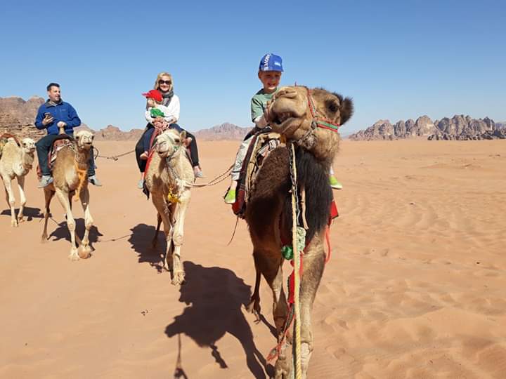 Camel riding in Wadi Rum with kids