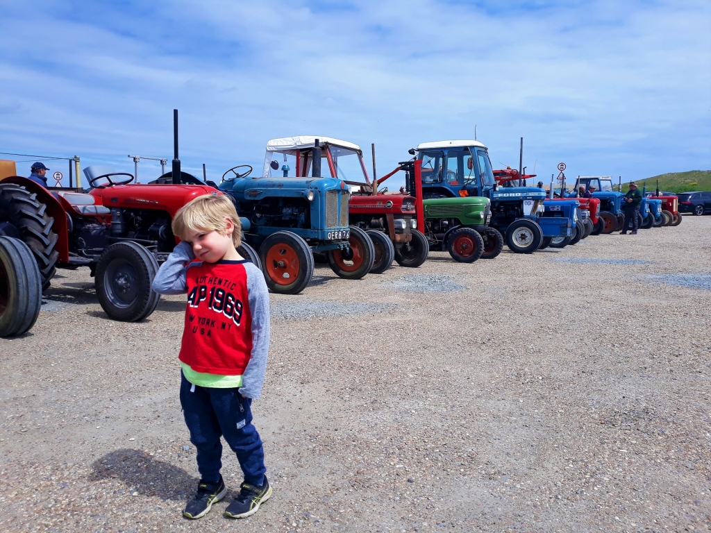 Gathering of Suffolk farmers and their old tractors at Dunwich beach