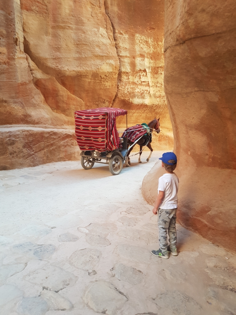 Watching the horse and carts in the Siq in Petra