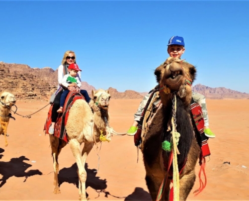 Visiting Jordan with kids: camel riding in Wadi Rum