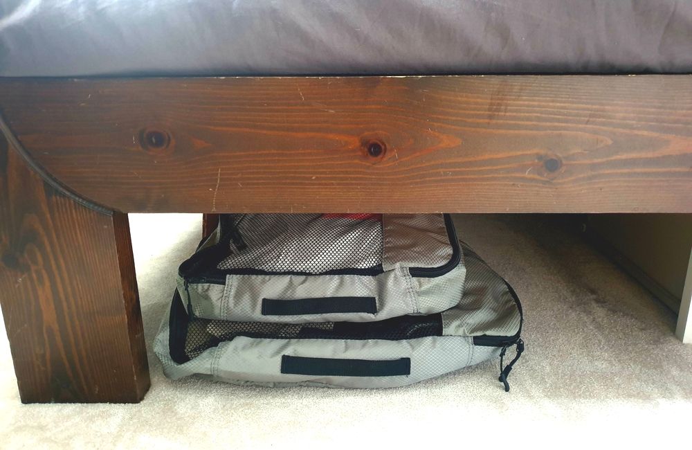 Using packing cubes for under-bed storage