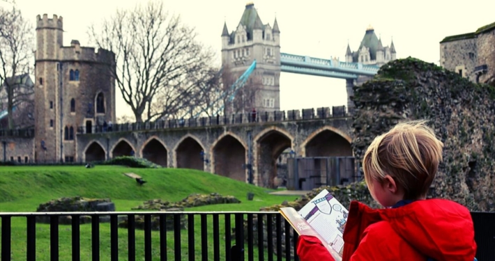 Studying the guidebook at the Tower of London