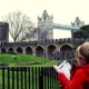 Studying the guidebook at the Tower of London