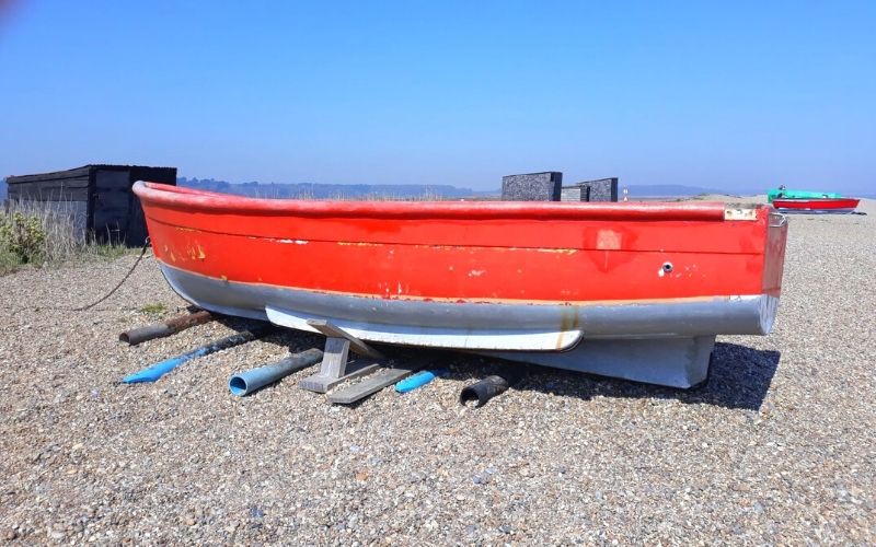 Red fishing boat on Dunwich Beach.