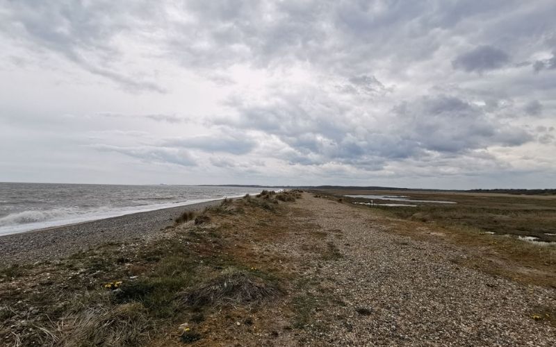 Walberswick beach facing south towards Dunwich on a cloudy day.