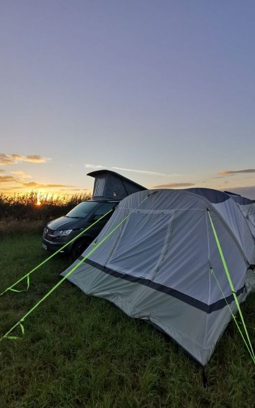 VW Campervan with Olpro Cocoon Breeze awning at sunset.
