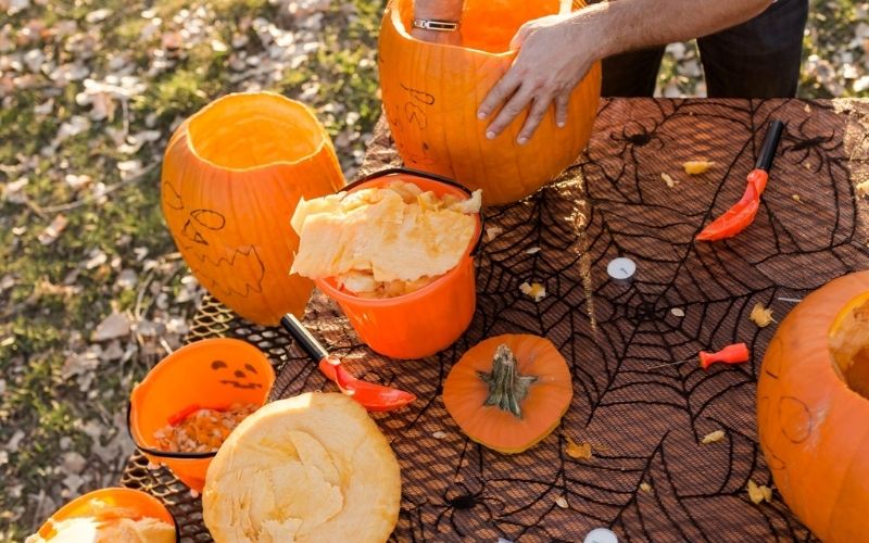 Carving pumpkins while pumpkin picking in Bedfordshire