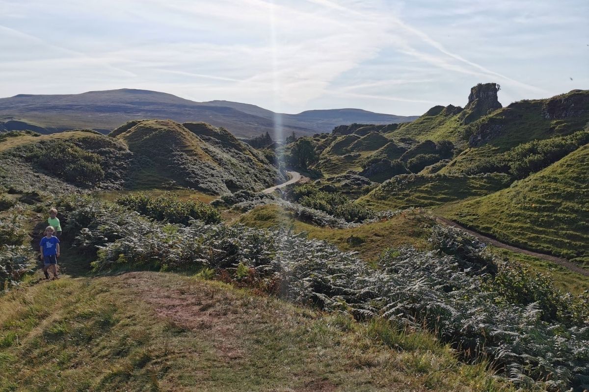 Path through the small hills at the Fairy Glen on Skye on a sunny day.