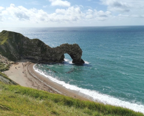 Views of Durdle Door and Durdle Door beach from the South West Coast Path in Dorset.