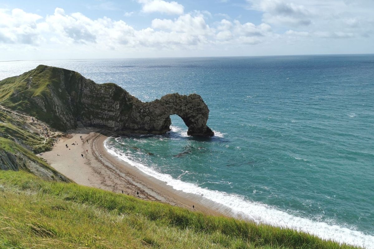 Views of Durdle Door and Durdle Door beach from the South West Coast Path in Dorset.