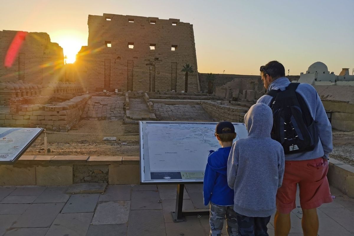 Visiting Karnak Temple in Luxor with kids at sunrise.