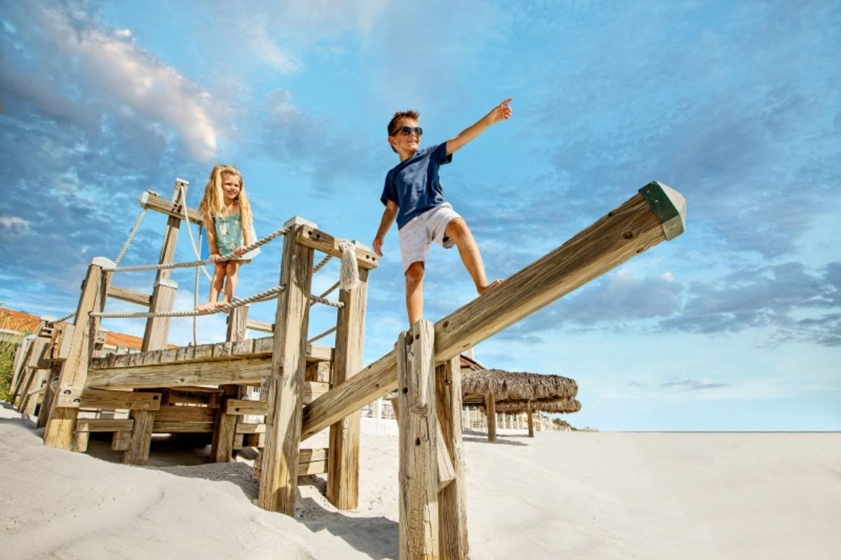 Kids playing on the beach at Ponte Vedra Inn - one of the best Florida beach resorts for families.