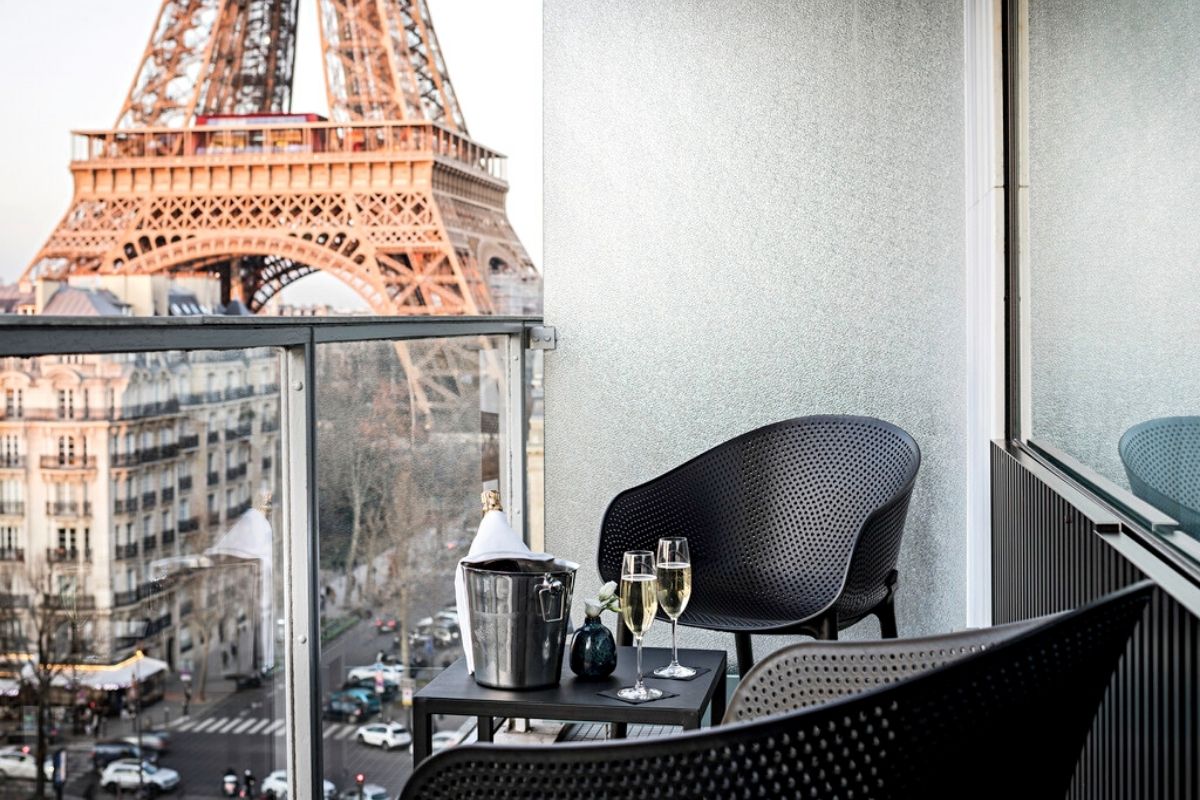 Pullman Paris Eiffel Tower Deluxe room with balcony view of the Eiffel Tower.