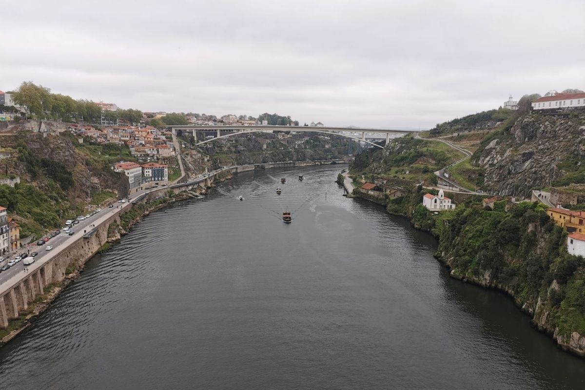 Boats cruising on the Douro River in Porto.