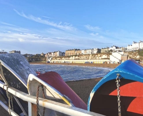 Boats in the foreground with Viking Bay beach in Broadstairs in the background.