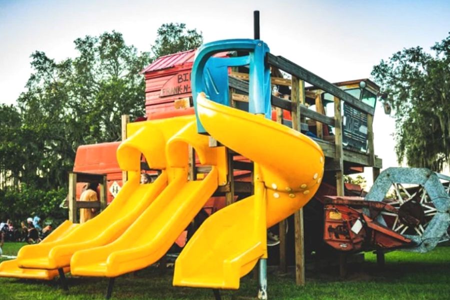Combine harvester play area with slides at Harvest Holler Corn Maze in Florida.