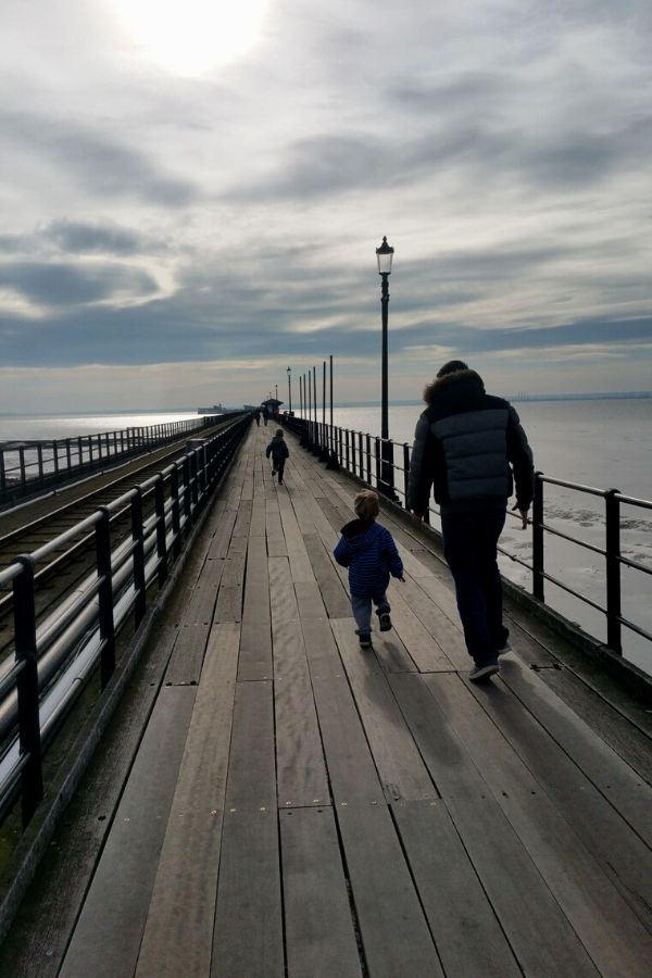 Family walking along Southend on Sea Pier.