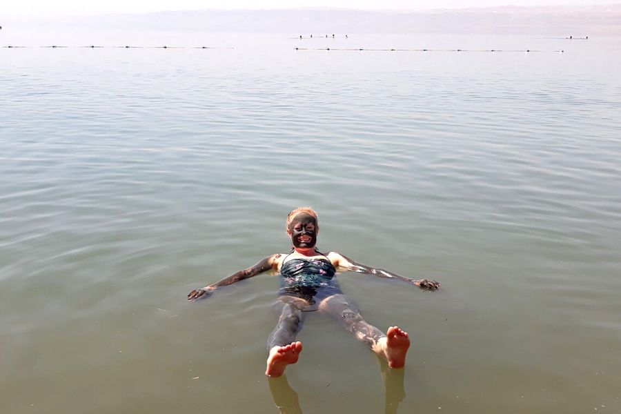 People Swimming In A Lake