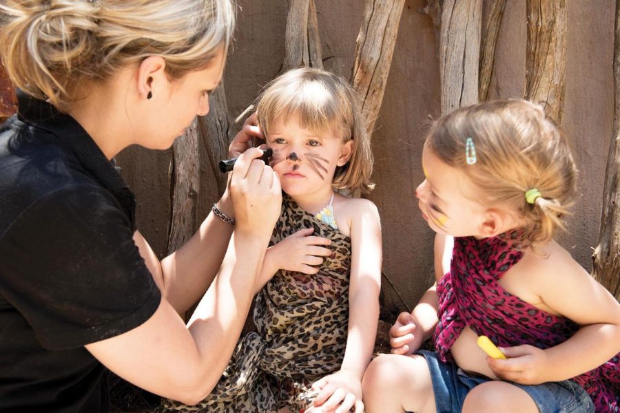 Kids getting their faces painted at the kids club at Madikwe Hills Private Game Lodge.