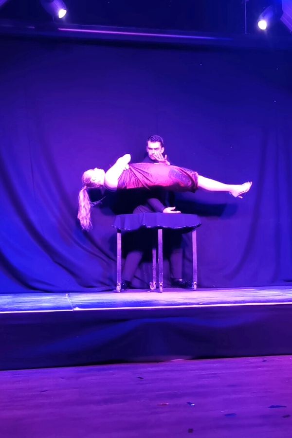 Levitating woman during the Matricks Illusion magic show at Sandy Balls Holiday Village.