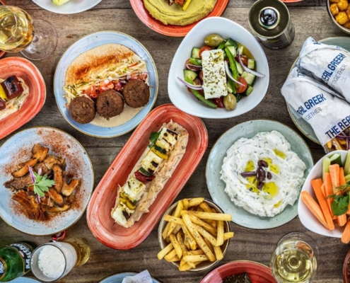 Displays of Greek food at The Real Greek where kids eat free in London on Sundays.