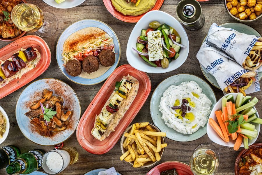 Displays of Greek food at The Real Greek where kids eat free in London on Sundays.