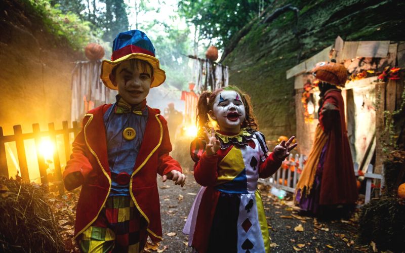 Young children dressed in Halloween costumes at Warwick Castle - one of the best places to spend Halloween at Merlin attractions in the UK.