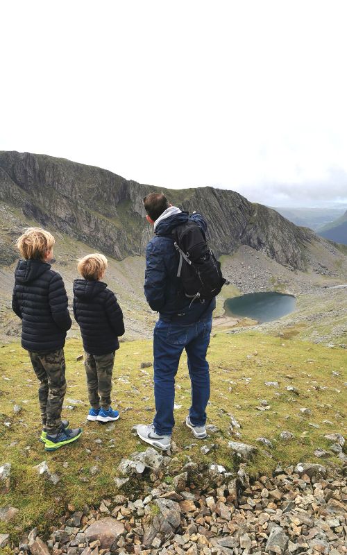 Family enjoying the views surrounding Mount Snowdon at Clogwyn Station after taking the Snowdon Mountain Railway.