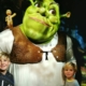 Two young boys standing in front of a large Shrek for my review of Shrek's Adventure in London.
