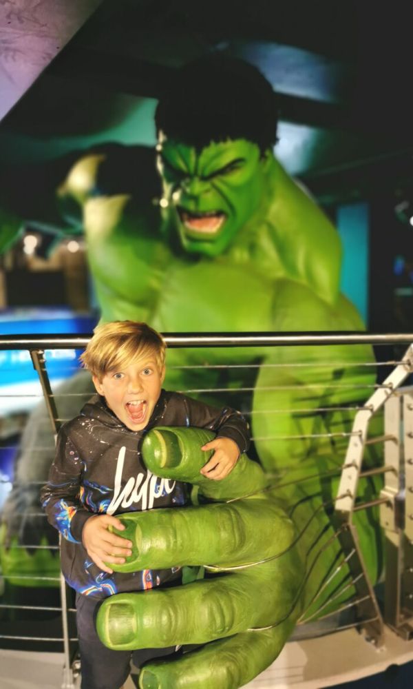Young boy being grabbed by a huge Incredible Hulk at Madame Tussauds in London.