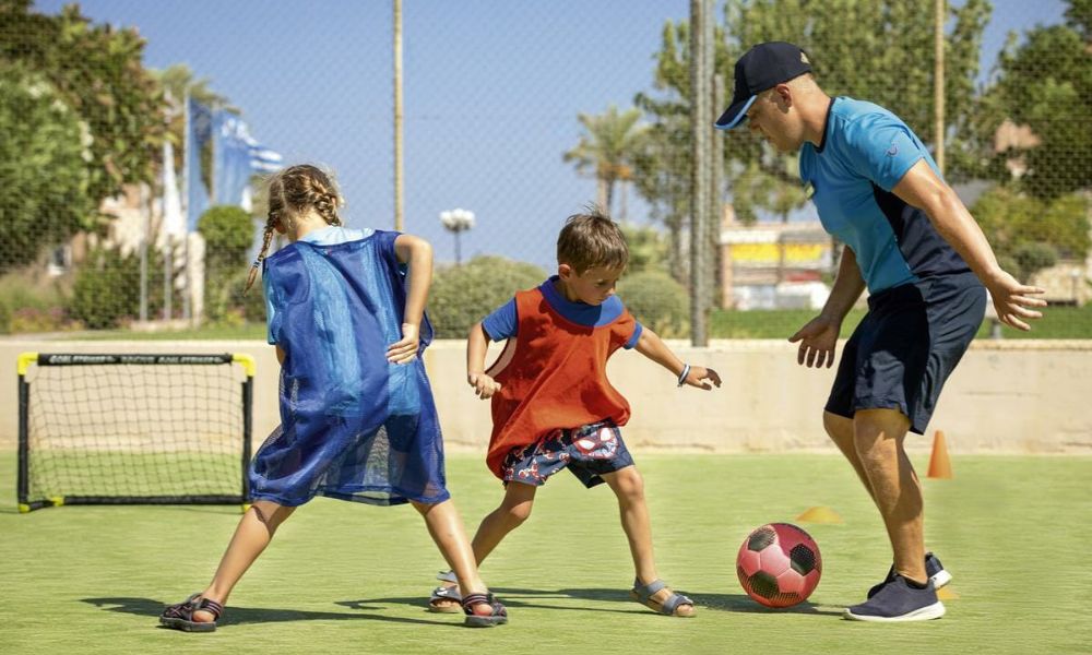 Children playing football at a TUI BLUE Hotel football academy.
