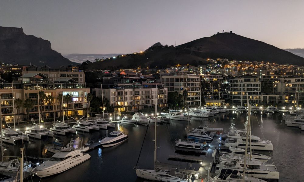 Dusk view of the marina at the V&A Waterfront and Table Mountain from a balcony at the Cape Grace hotel in Cape Town