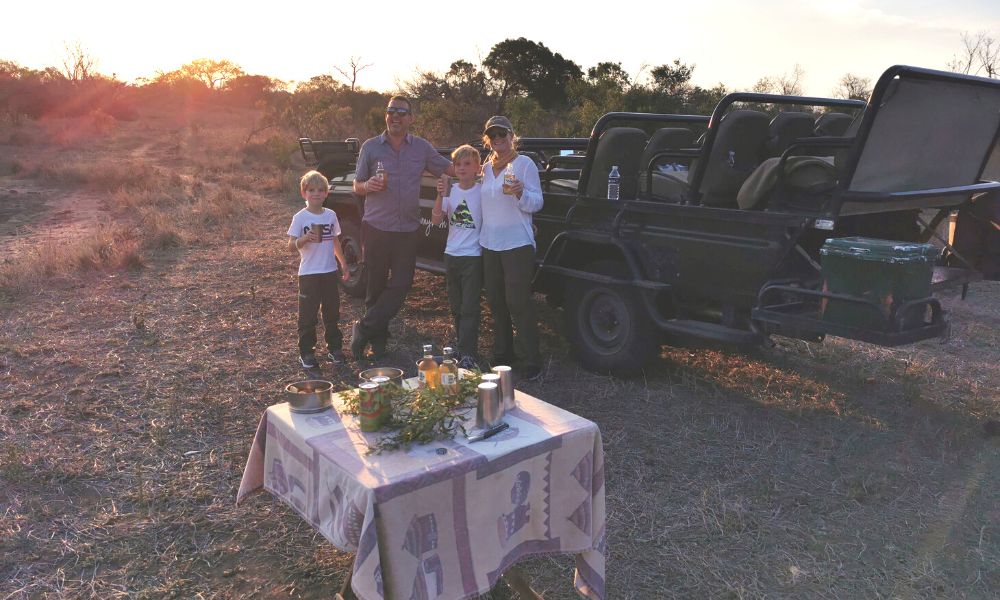 Family on a sunset safari at Jackalberry Lodge in Thornybush Game Reserve.