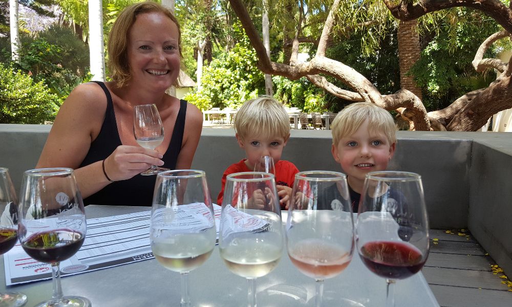 Family wine tasting in South Africa - one of the more unusual things to do in the Cape Winelands with kids.