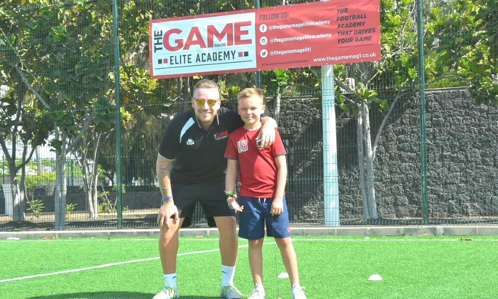 Jamie O'Hara - ex Spurs, Fulham and Wolves midfielder pictured with a boy attending one of the THB hotels football academies in Lanzarote.