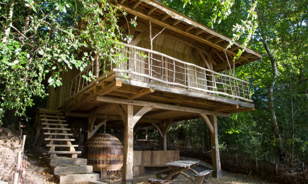Rustic treehouse cabin at Wildnerness Wood in East Sussex.