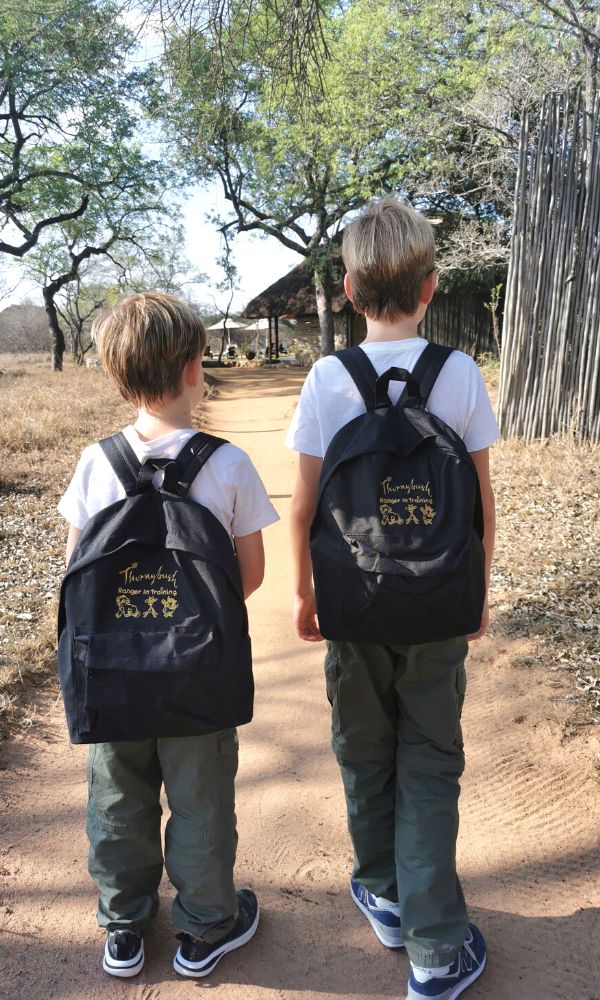 Two little boys wearing their Ranger in Training backpacks from Thornybush.