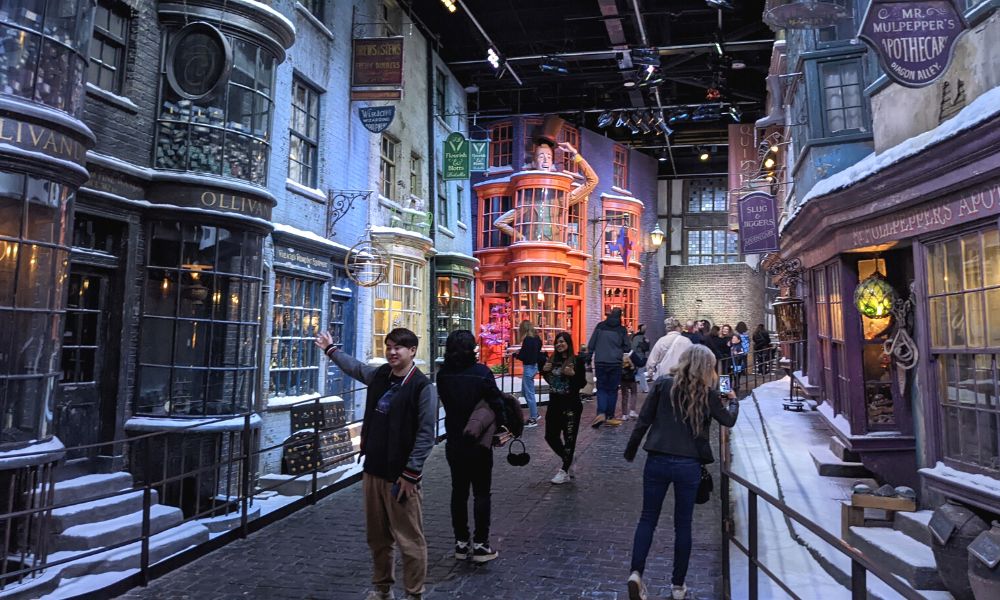 Diagon Alley at the Harry Potter Studio Tour London full of people.