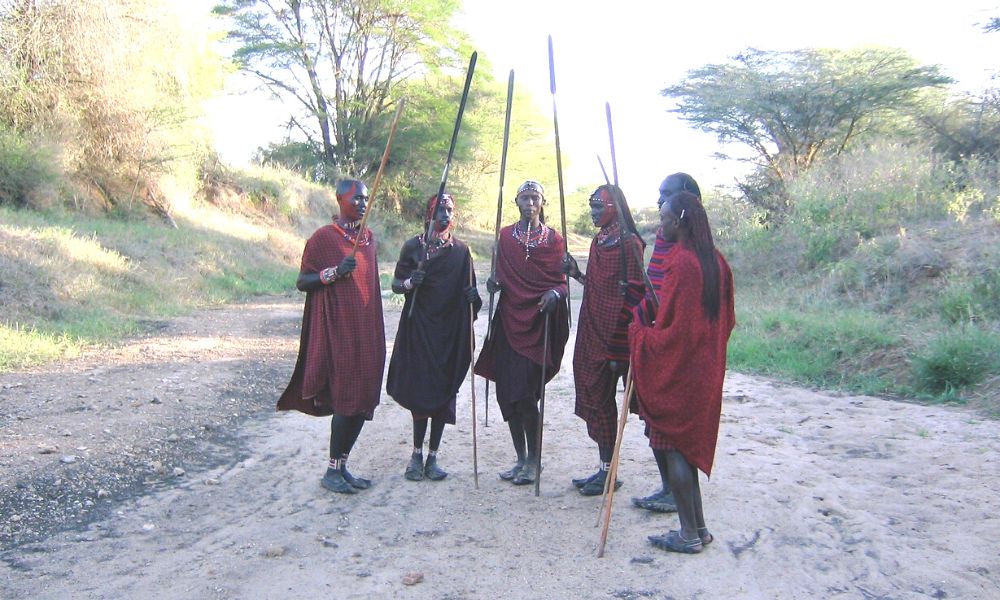 Group of Maasai Tribes people in a dry riverbed in Kenya.