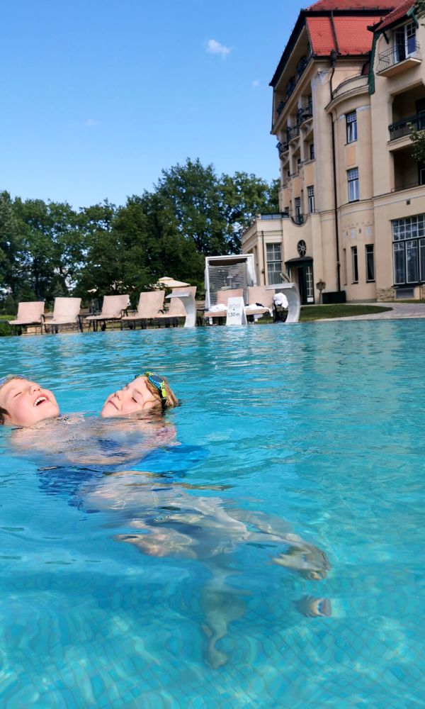 Kids playing in the thermal pool at Thermia Palace Ensana Hotel in Piestany in Slovakia.