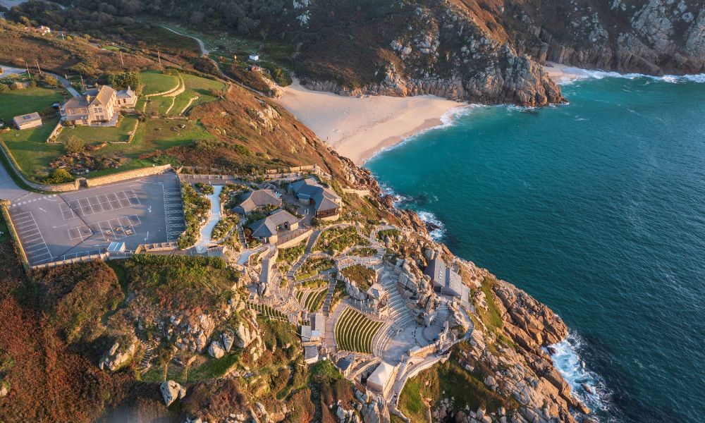 Aerial view of the Minnack Theatre with Porthcurno beach in the background.
