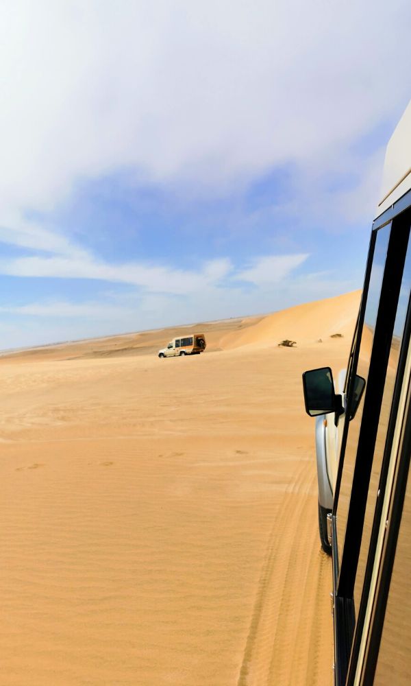 4x4 jeep heading into the sand dunes in Dorob National Park near Swakopmund.