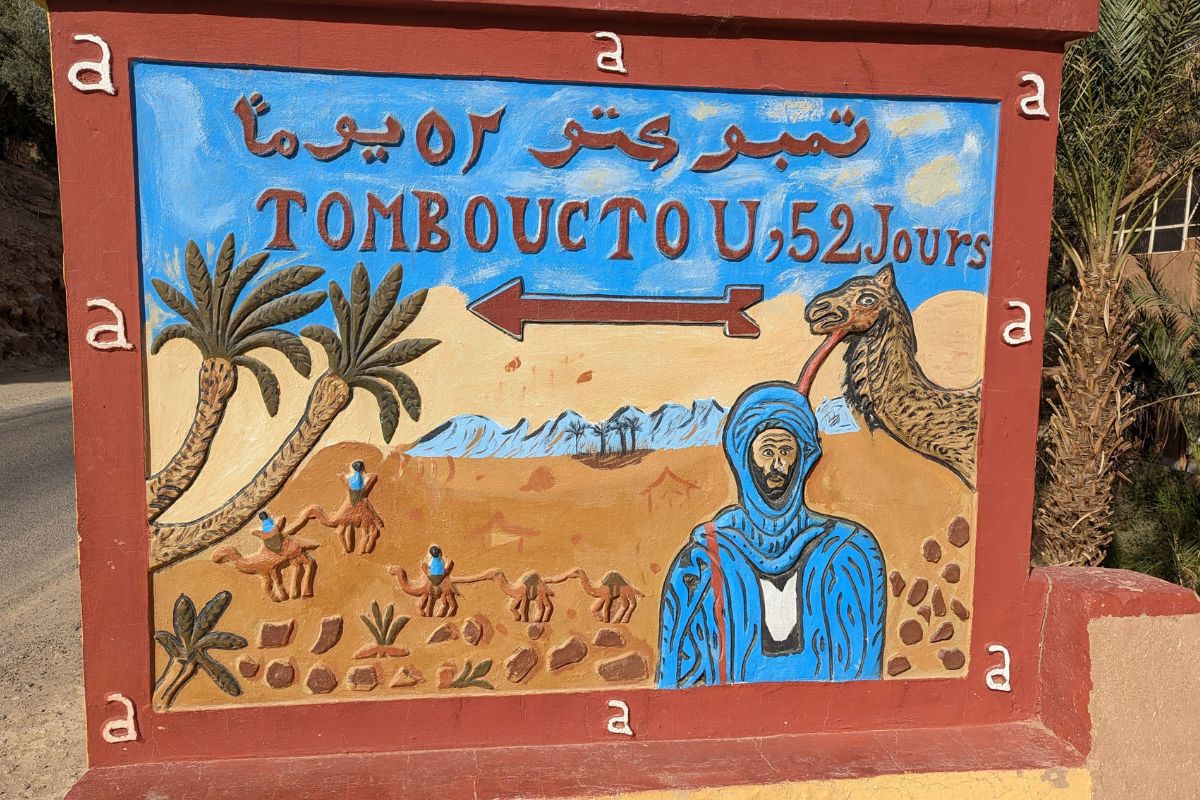 Sign showing 52 days from Timbuktu to Zagora.