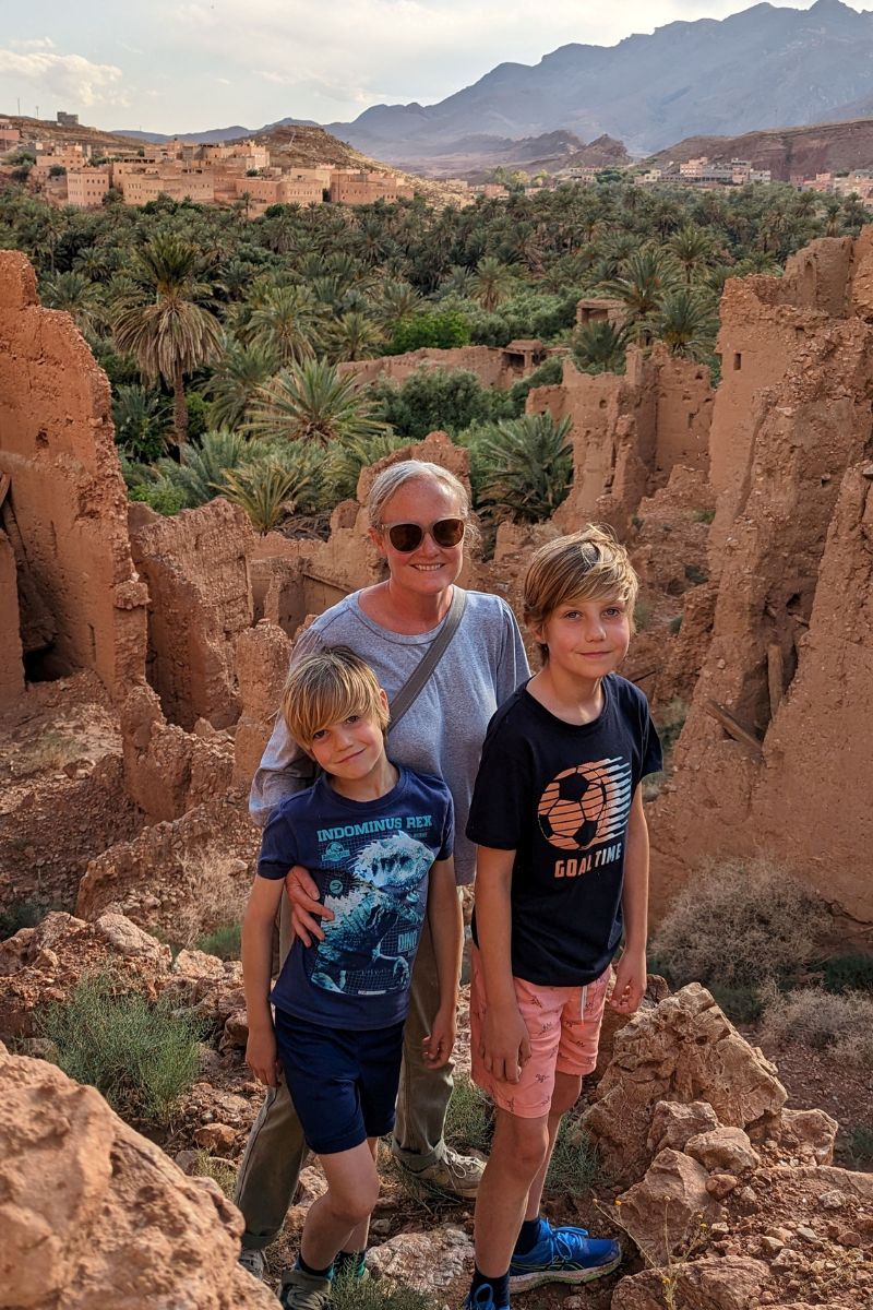 Family exploring the ruins of a kasbah in Tinerhir in Morocco.
