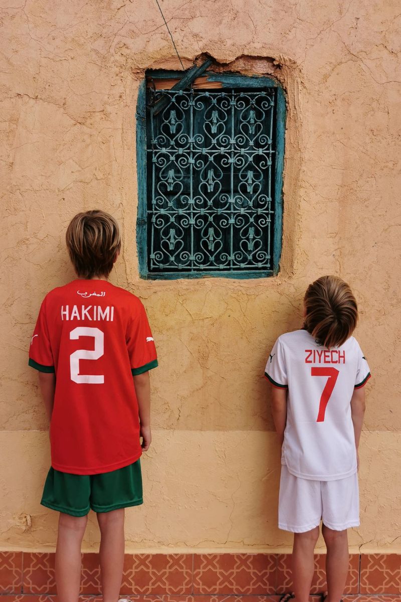 Two young boys in Morocco football kits.