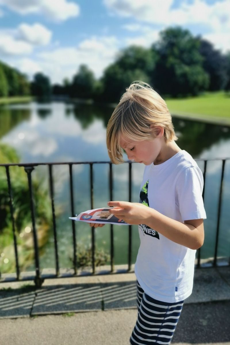 Boy studying a Treasure Trails Map.