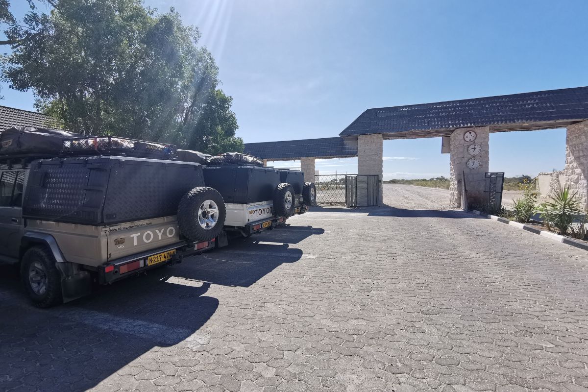 Car park at Okaukuejo Camp in Etosha National Park full of 4x4 jeeps.