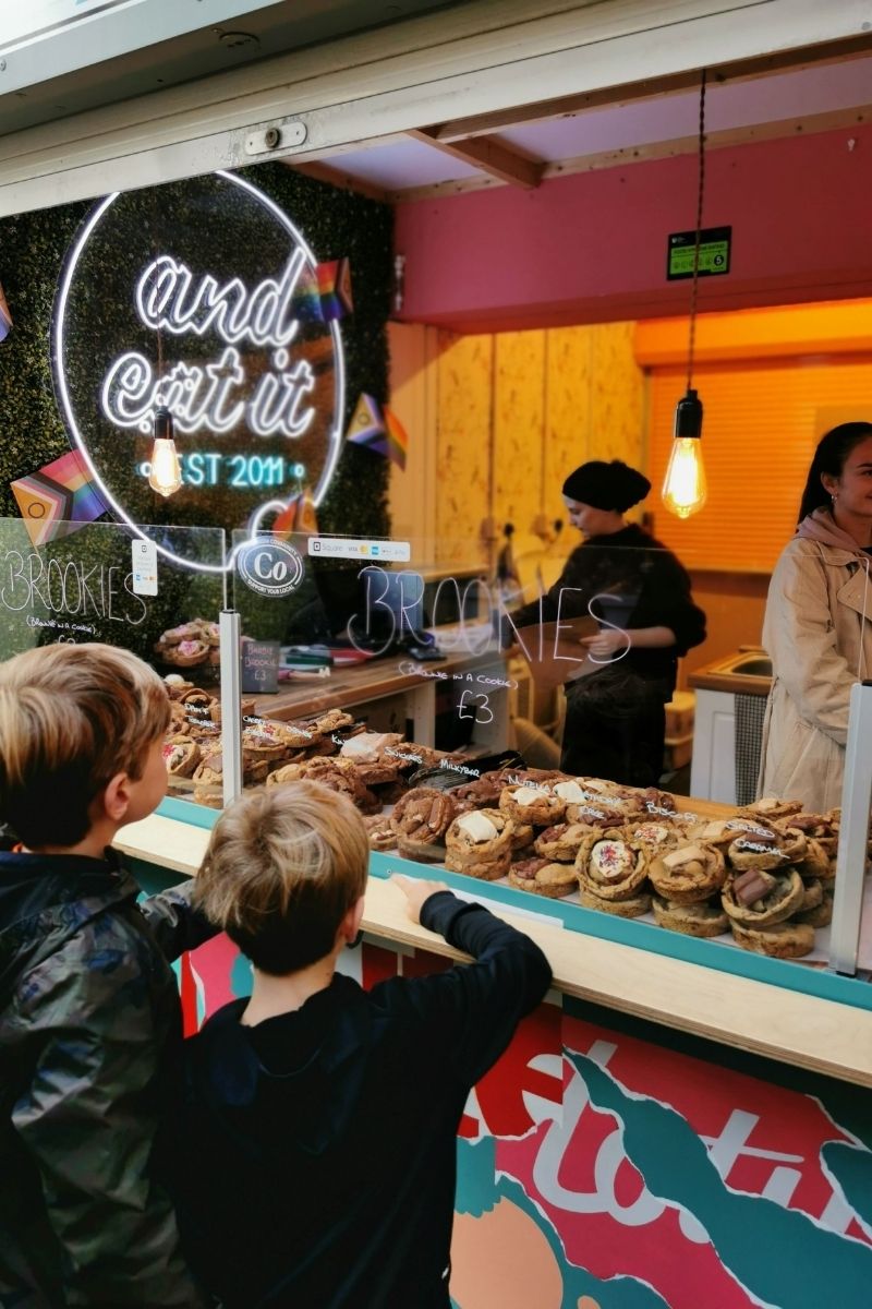 Kids choosing a brookie at And Eat It stall in Norwich Market.